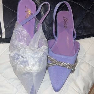 Pointed toe flats with crystal beading.